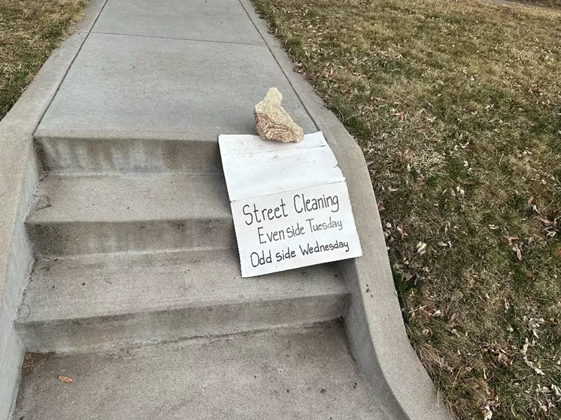 Image: A street-sweeping warning sign in Congress Park.