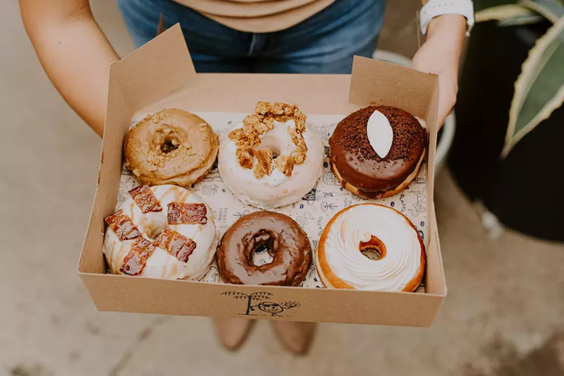 Image: top view of a box of donuts