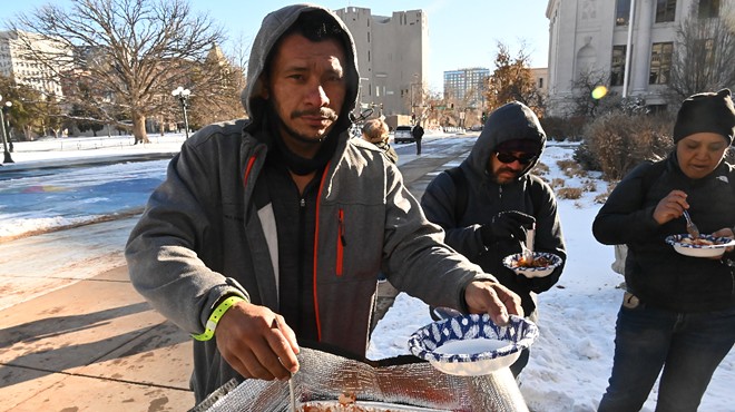 A migrant gets a warm meal.