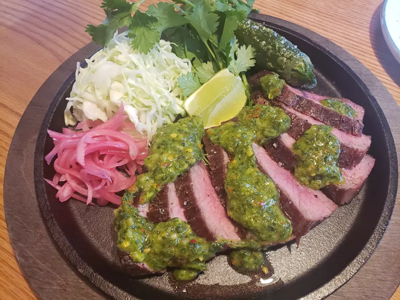 Image: Grilled flank steak with chimichurri at Mister Oso.