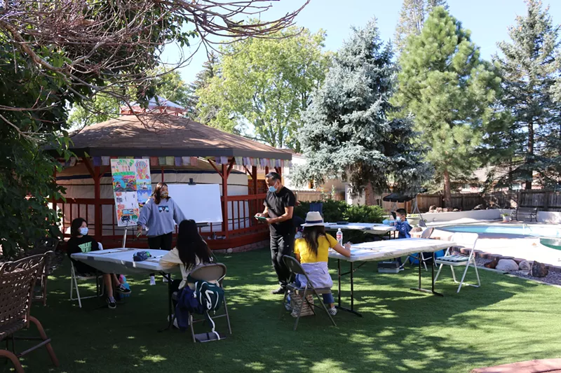 Image: Uran Biir art students receive instruction outside, beside the yurt.