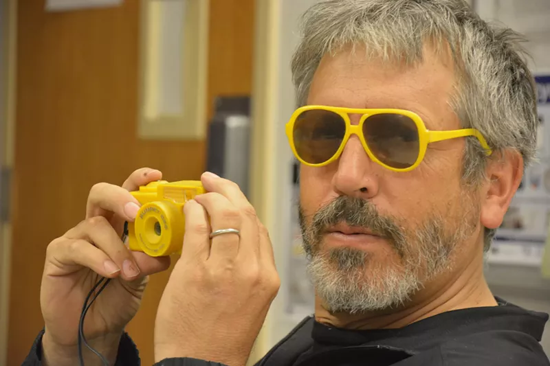 Image: Carol Dass, “Sun Pet camera and matching glasses'" a portrait of Mark Sink, subject of the RedLine retrospective “typed live, excuse errors”.