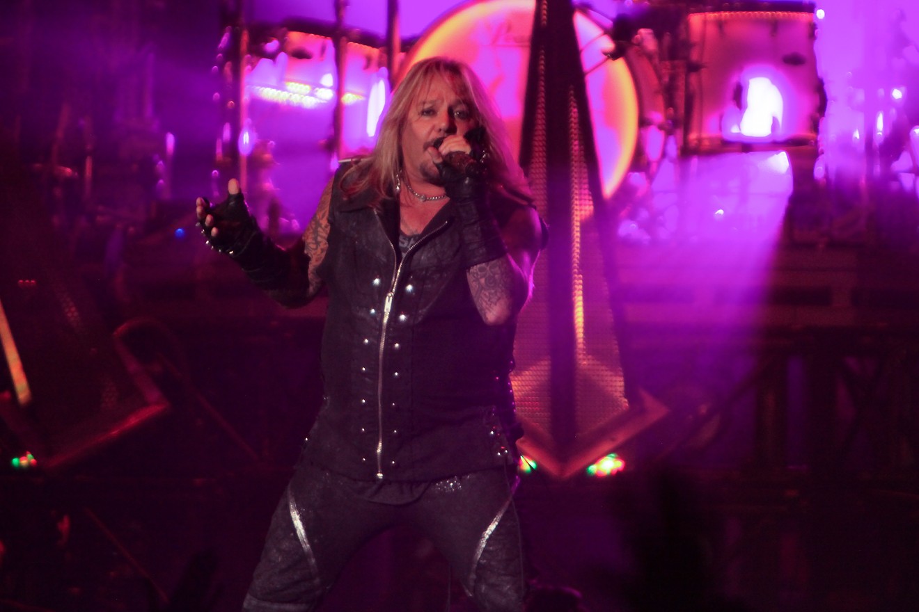 Vince Neil of Mötley Crüe performing on stage at the Pepsi Center.