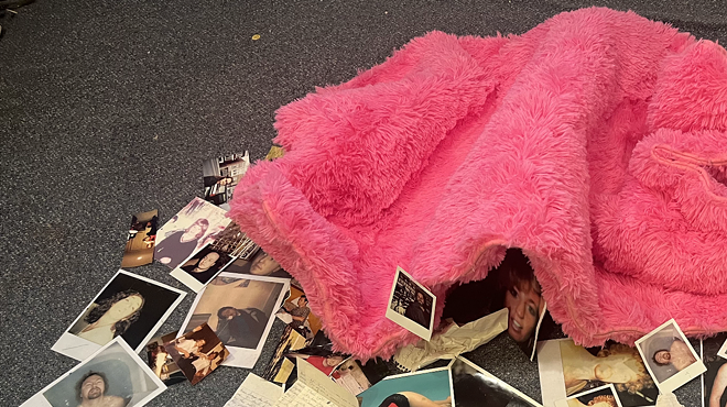A pink shag rug surrounded by photos and letters