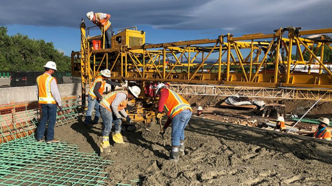 A crew pours concrete for the South Platte Bridge during work on the C-470 project.