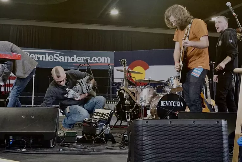 Image: Dakota Diemand tunes a guitar at a Bernie Sanders rally last month.