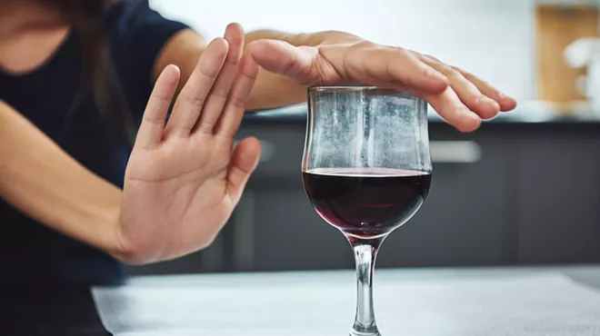 woman refusing wine