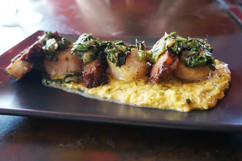 Image: Scallions and pork belly on smoked corn crema with charred-scallion gremolata.