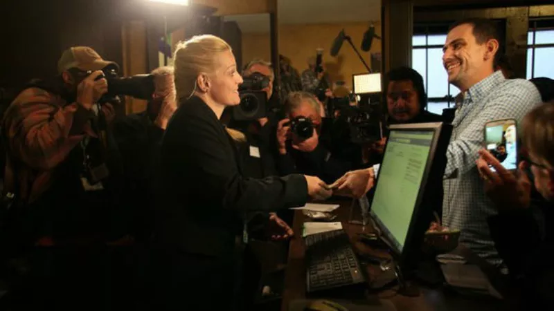 Image: Toni Fox makes the first legal recreational marijuana sale in Colorado at 3D Cannabis at 8 a.m. January 1, 2014.