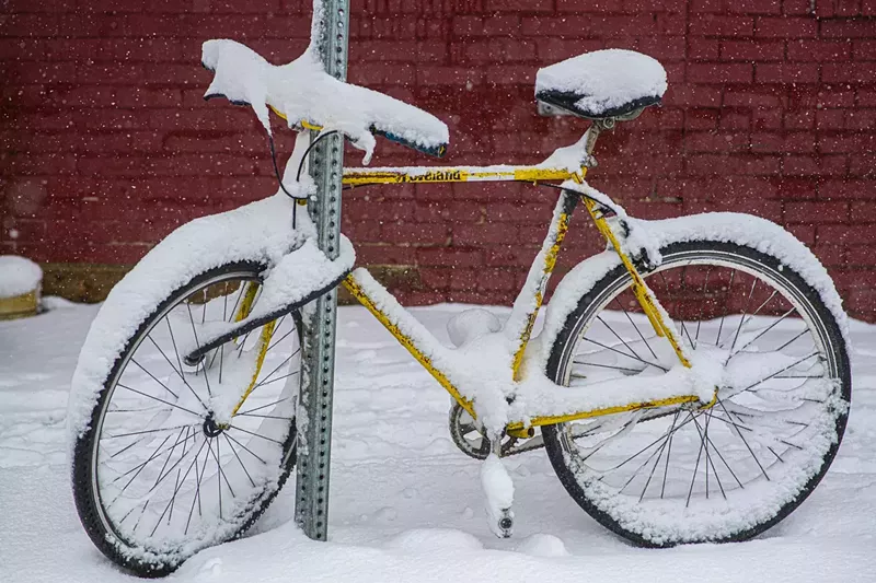 Image: bike covered in snow on street
