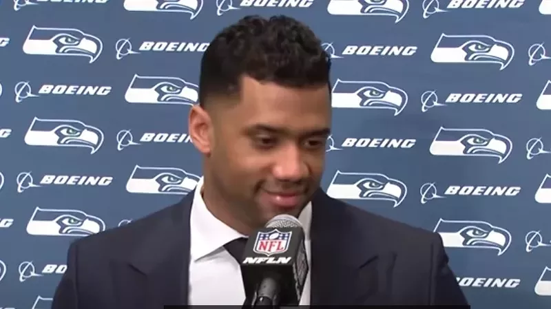 Image: Russell Wilson during his final post-game press conference as quarterback of the Seattle Seahawks.