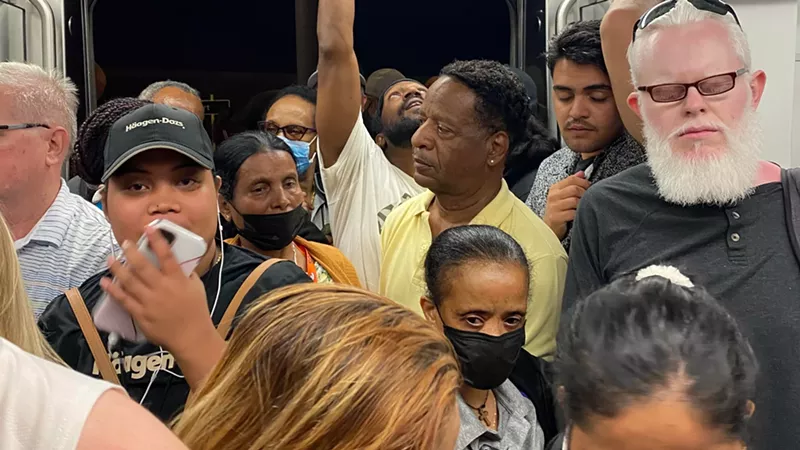 Image: Passengers packed onto an RTD A-Line train after a cancellation on July 10, 2022.