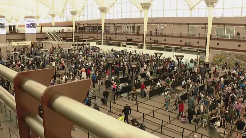 Image: Security lines were lengthy at Denver International Airport early on September 18.