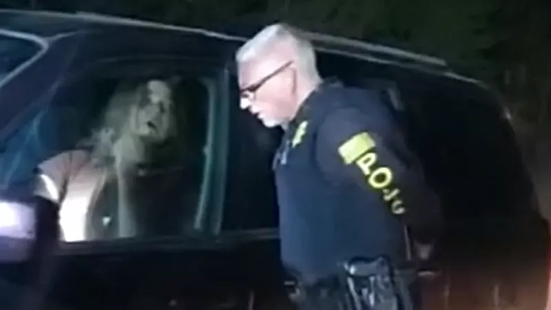 Image: A screen capture from June body-camera footage shows Christian Glass chatting casually with a law enforcer shortly before he was shot to deeath.