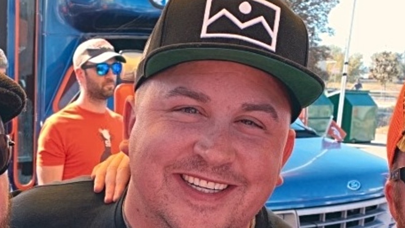 DNVR's Brandon Spano rocks a cap with the site's logo in this 2019 portrait.