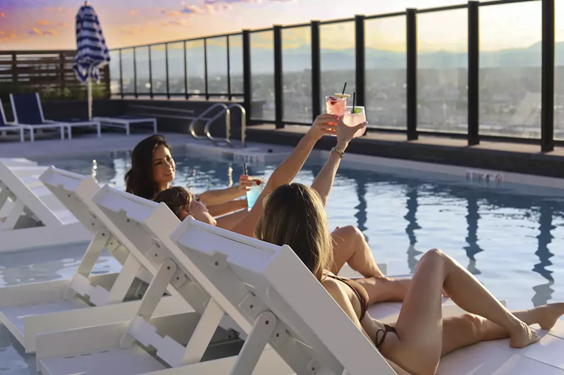 Image: two women by pool