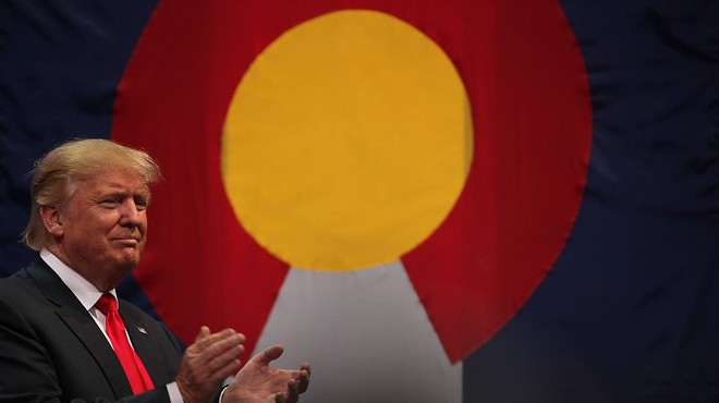 donald trump in front of Colorado flag
