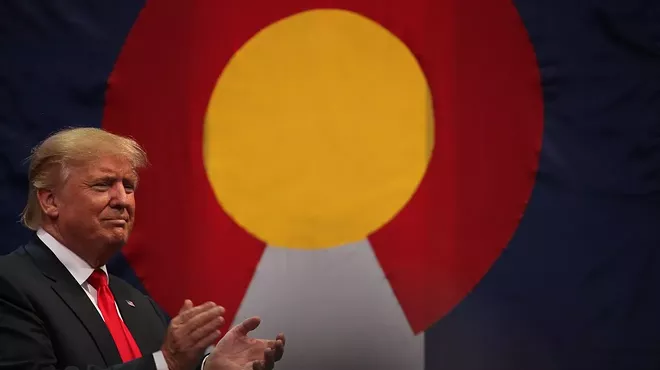 donald trump in front of Colorado flag