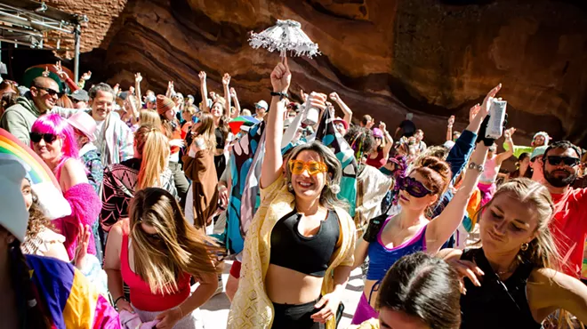 People dance at Red Rocks.