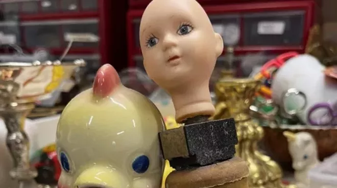 a duck and a plastic baby doll