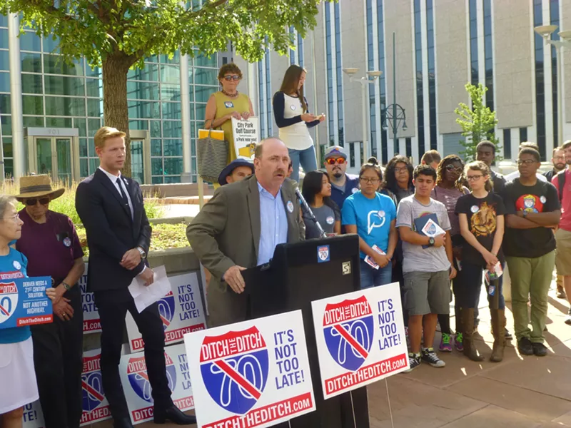 Image: At a press conference outside the federal courthouse, Brad Evans vowed that the plaintiffs would fight the highway expansion "in every possible way, " while developer Kyle Zeppelin (in dark suit) looked on.