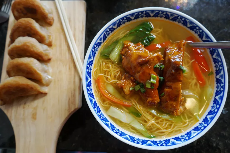 Image: Egg-noodle soup with pork ribs and a side of beef-filled dumplings.
