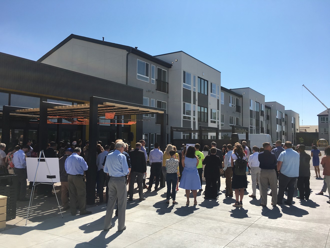 Crowds gathering to see the brand-new Moline Apartments, an affordable-housing complex in Stapleton.