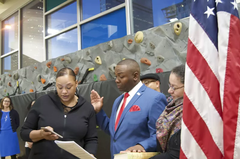 Image: Tay Anderson's mother swears him in, drawing up an emotional moment at the December 4 inauguration ceremony.