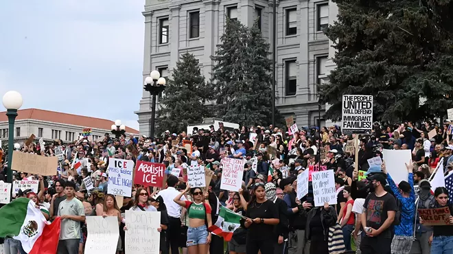 Crowd of anti-ICE protesters on steps of Denver capitol