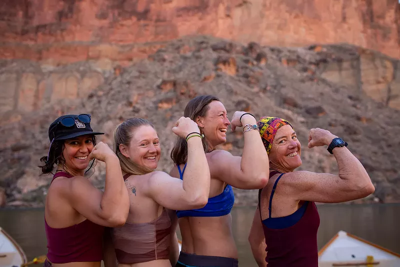 Image: Four women pose together in the Grand Canyon.