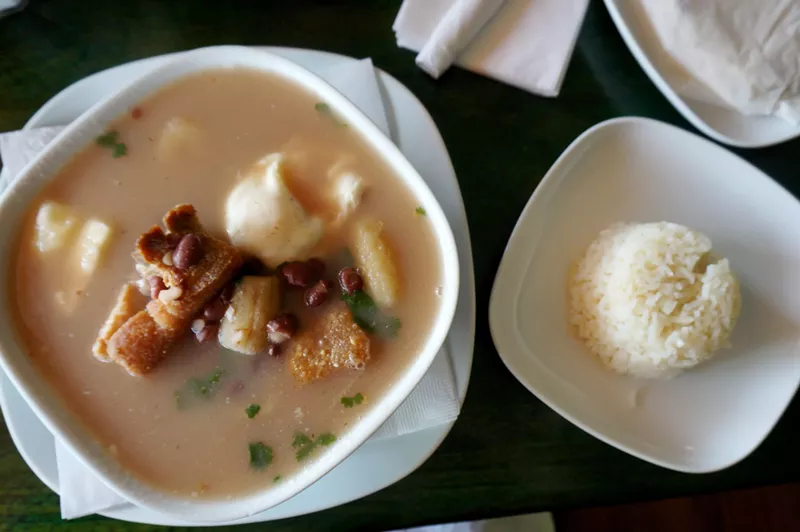 Image: Black bean and chicharron soup with plantains and yuca at Honduras Breeze.