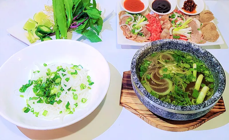 Image: Pho Two Bowls comes with broth in a hot stone bowl and noodles in a separate bowl.