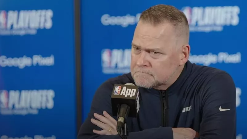 Image: Denver Nuggets coach Michael Malone, seen during a post-game press conference, wore this expression for much of his squad's May 4 loss to the Minnesota Timberwolves.