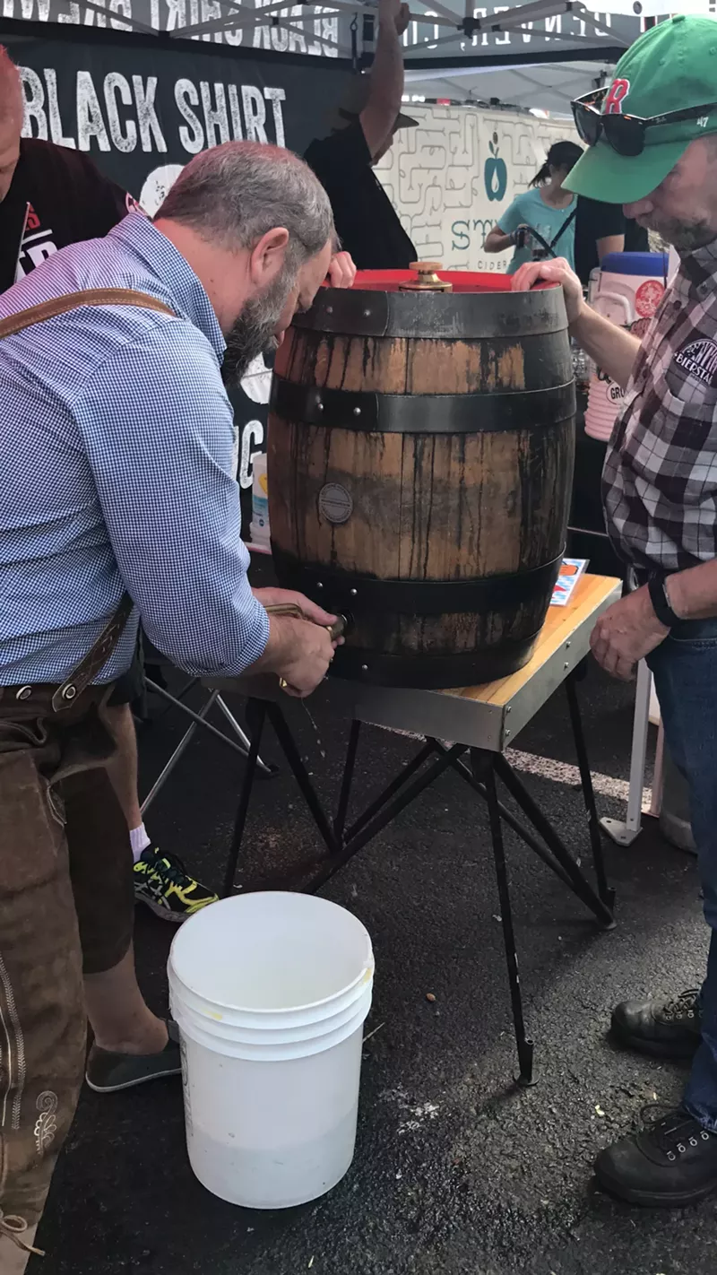 Image: A lederhosen-clad Bill Eye, brewer at Bierstadt Lagerhaus, taps an Oktoberfest keg.