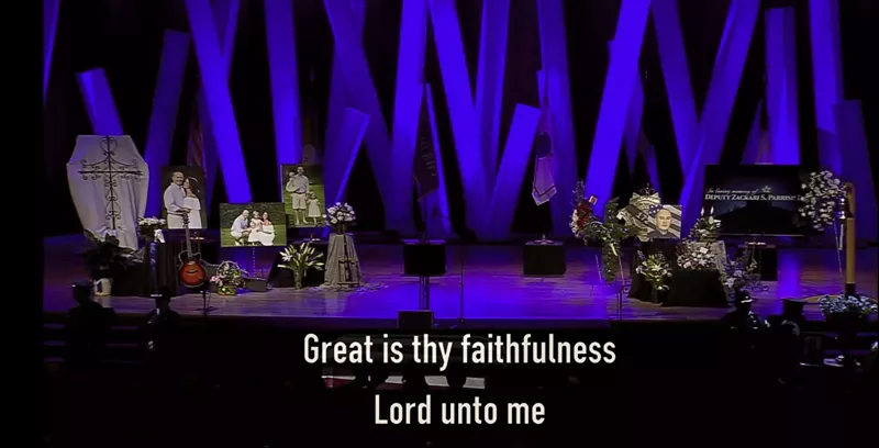 Image: Screenshot of Douglas County Deputy Zackari Parrish's funeral at Cherry Hills Community Church, which was live-streamed to the web.