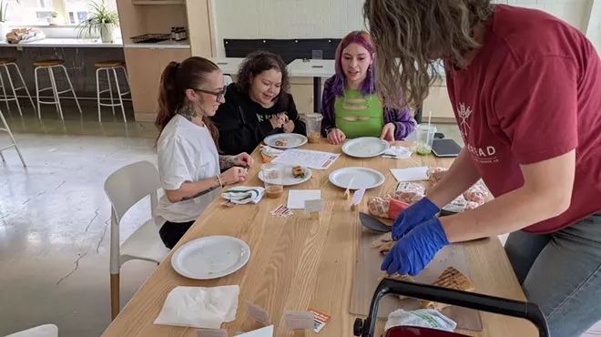 youth at table picking pastries