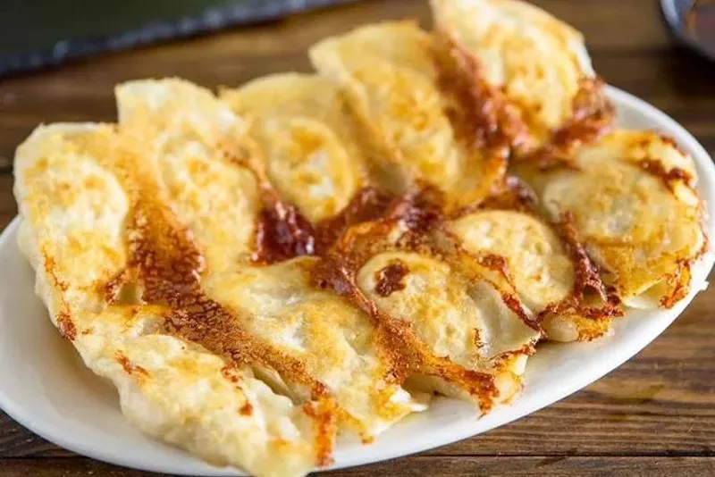 Image: Crispy pan-fried dumplings are the top seller at Mason's Dumpling House.