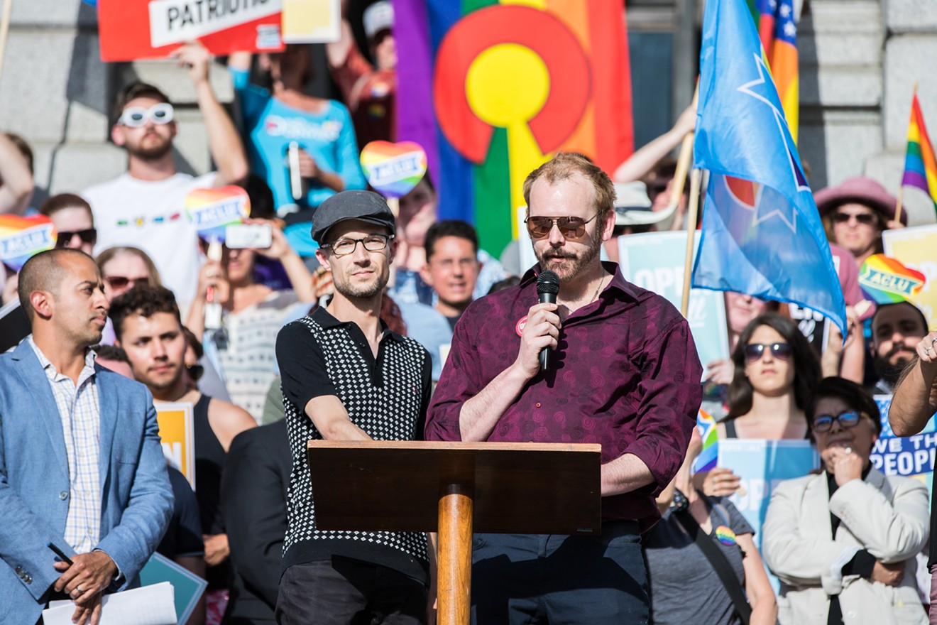 Dave Mullins, left, and Charlie Craig speak at a rally in response to the Masterpiece Cakeshop Supreme Court ruling on June 4, 2018.