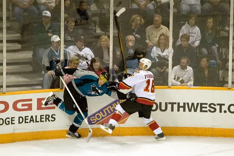 Image: Jeff Friesen (left) took a lot of hits during his twelve-year career, including this one in 2006.