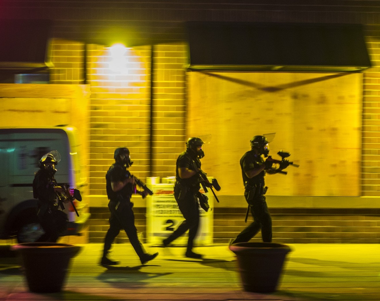 Police patrol Denver streets on the fourth night of protests.