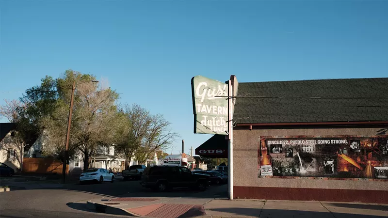 Image: Gus' Tavern and Gagliano's Italian Market & Deli, two of Pueblo's iconic haunts, sit under the smokestacks of the former Colorado Fuel & Iron Steel Mill, now Evraz.