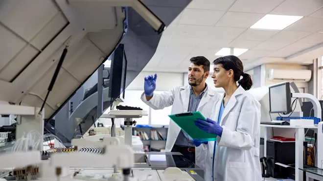 man and woman in lab coats