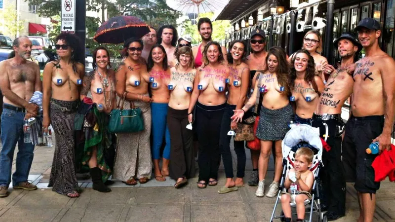 Image: A Denver GoTopless Day group photo from 2014. That's current co-organizer Matt Wilson at the far right.