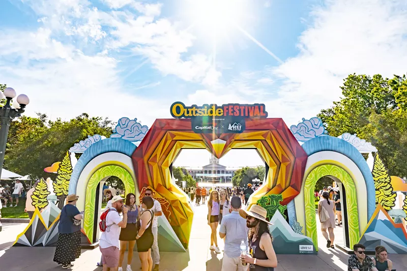 Image: Festival attendees enter the Outside Festival on Saturday.