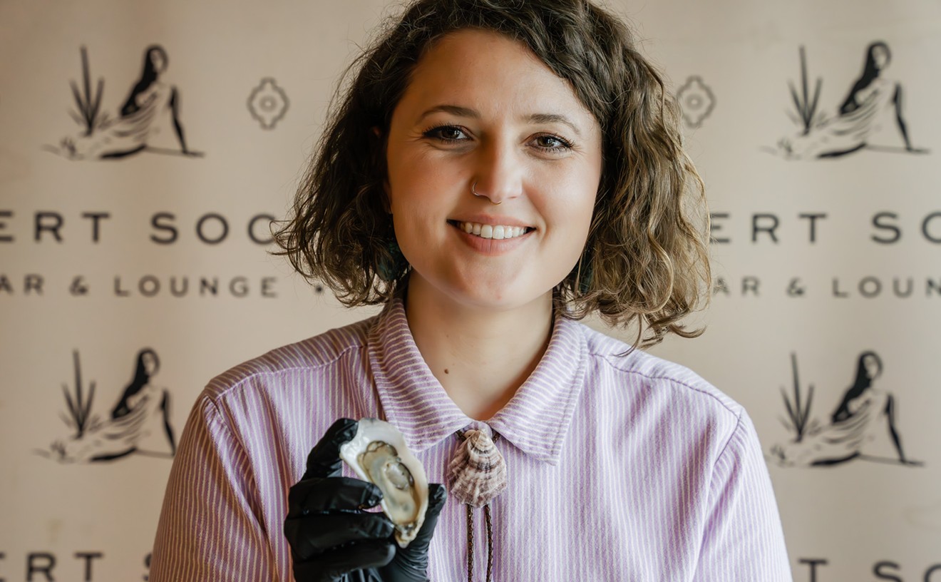woman holding an oyster