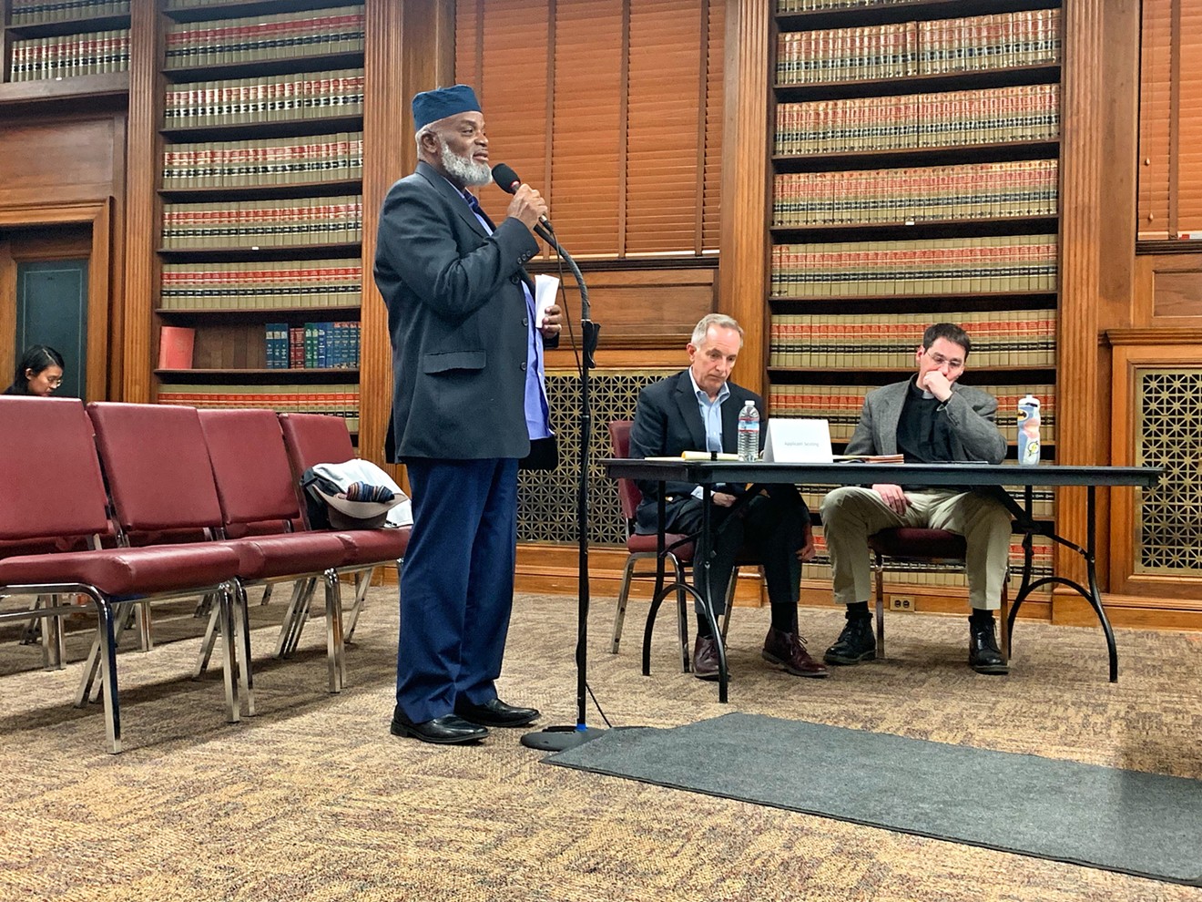 Imam Abdur Rahim Ali voicing his concerns about affordable housing to the Denver Planning Board on December 19.