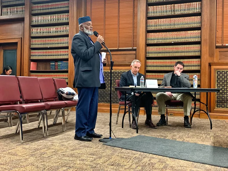 Image: Imam Abdur Rahim Ali voicing his concerns about affordable housing to the Denver Planning Board on December 19.