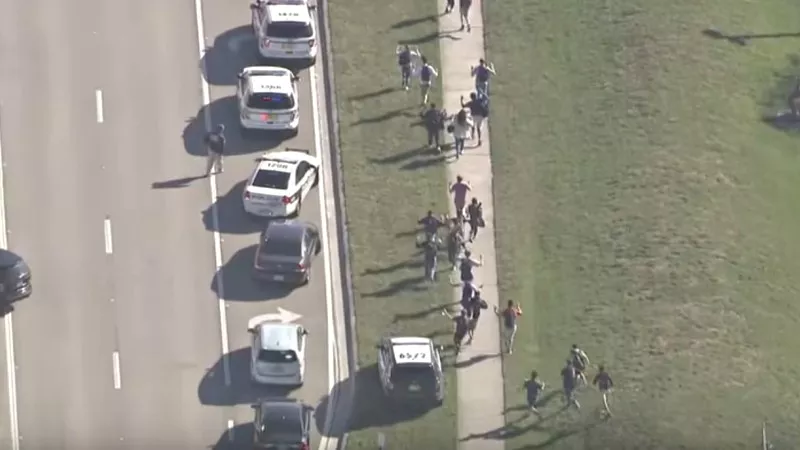 Image: Images from the aftermath of yesterday's school shooting in Parkland, Florida can't help recalling similar coverage during the 1999 attack on Columbine High School.
