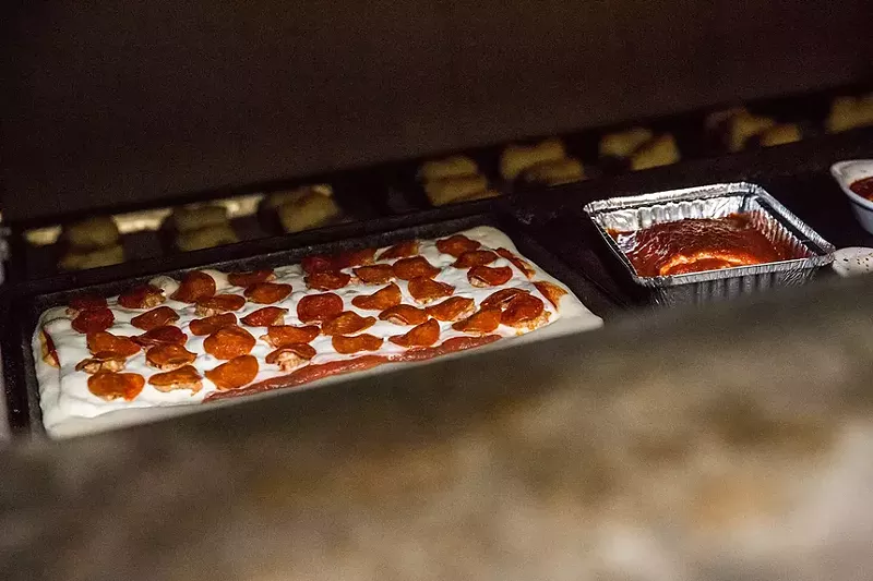 Image: square pizzas coming out of oven