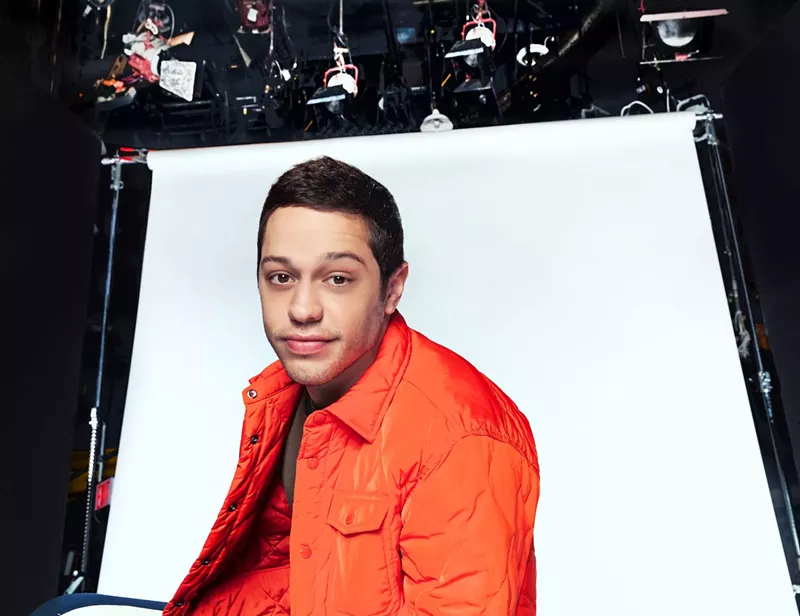 Image: man in an orange jacket